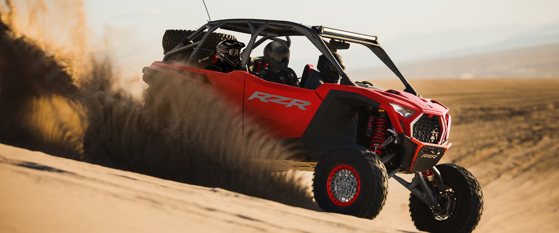 RZR Pro R group riding through the desert